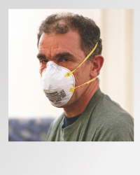 Nurse wearing face mask.